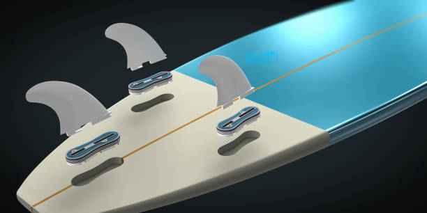 Surfboard fins attached to a light blue surfboard tail.